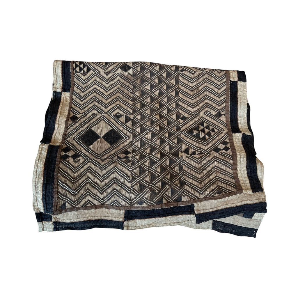 Tara Shaw authentic African Kuba cloth runner featuring intricate geometric patterns in earthy brown and black tones.