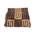 Tara Shaw authentic African Kuba cloth runner featuring handwoven geometric patterns in earthy brown and black tones.