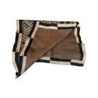 Tara Shaw authentic African Kuba cloth runner featuring handwoven geometric patterns in earthy brown and black tones.