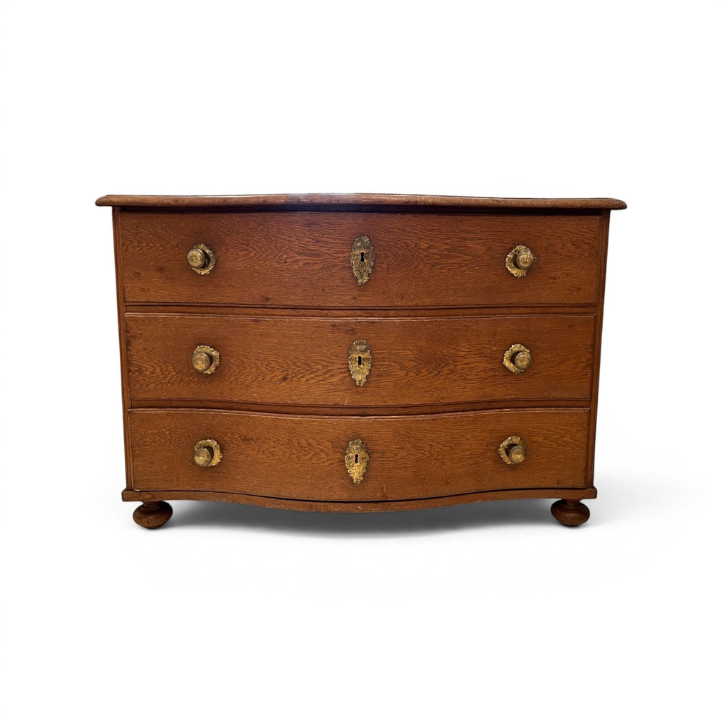 Tara Shaw 18th-century Alsace oak commode with three drawers, brass hardware, and a rich aged wood patina.