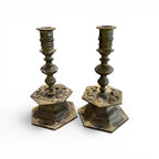 Tara Shaw pair of 19th century Belgian heavy bronze candlesticks with ornate hexagonal bases and aged patina.