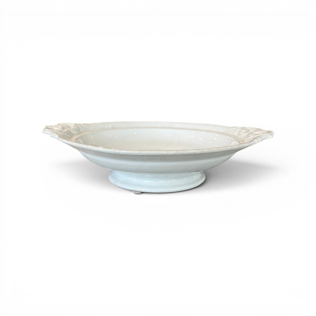 Tara Shaw 19th century European ironstone bowl with a classic pedestal base and elegant aged patina.