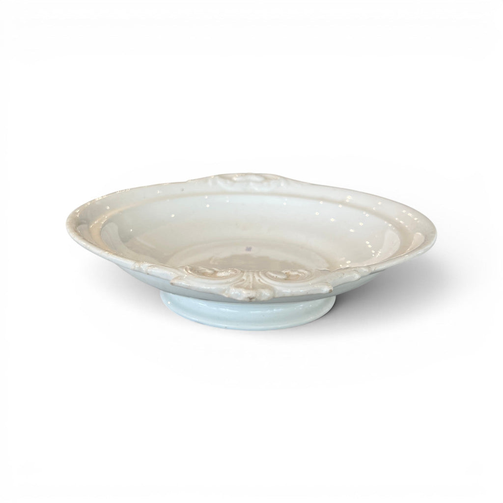 Tara Shaw 19th century European ironstone bowl with a white aged patina and elegant embossed rim detail.