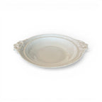 Tara Shaw 19th century European ironstone bowl with ornate handles and a weathered cream patina.