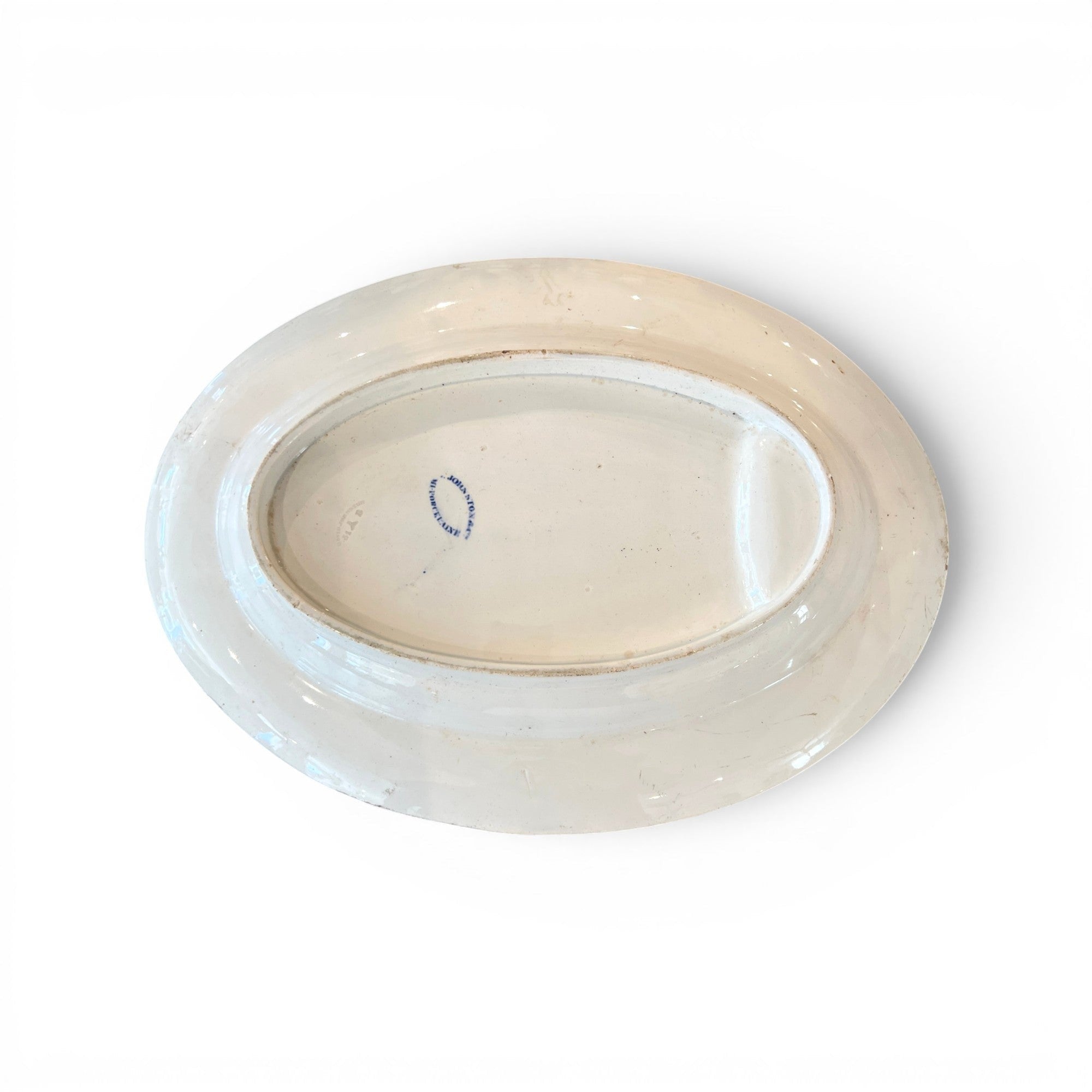 Tara Shaw antique 19th-century European white ironstone platter showing the underside with a blue maker's mark.