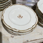 Tara Shaw antique white porcelain dessert plates with gold scalloped edges and a decorative MS monogram detail.
