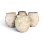 Tara Shaw set of four rustic 18th-century Spanish pottery jars with unique timeworn patina and textured finish.