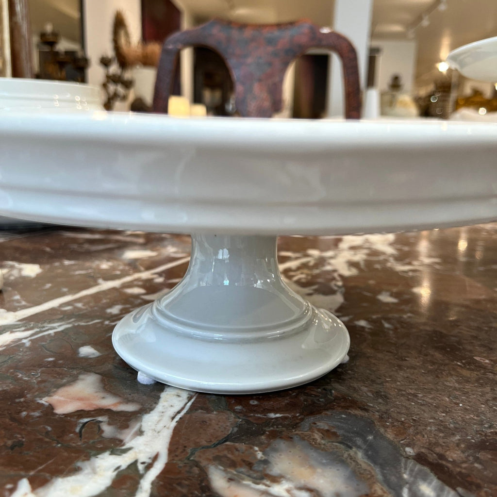 Tara Shaw antique 19th century European white ironstone cake plate with a classic pedestal base and aged patina.