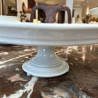Tara Shaw antique 19th century European white ironstone cake plate with a classic pedestal base and aged patina.