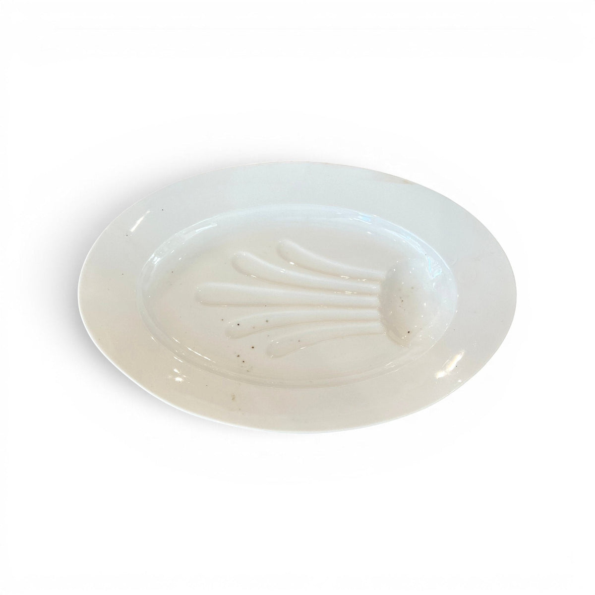 Tara Shaw antique 19th century white ironstone platter with a decorative shell-like well and aged patina.
