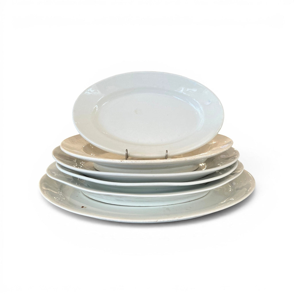 Tara Shaw collection of five assorted 19th century European antique white ironstone platters with aged patina