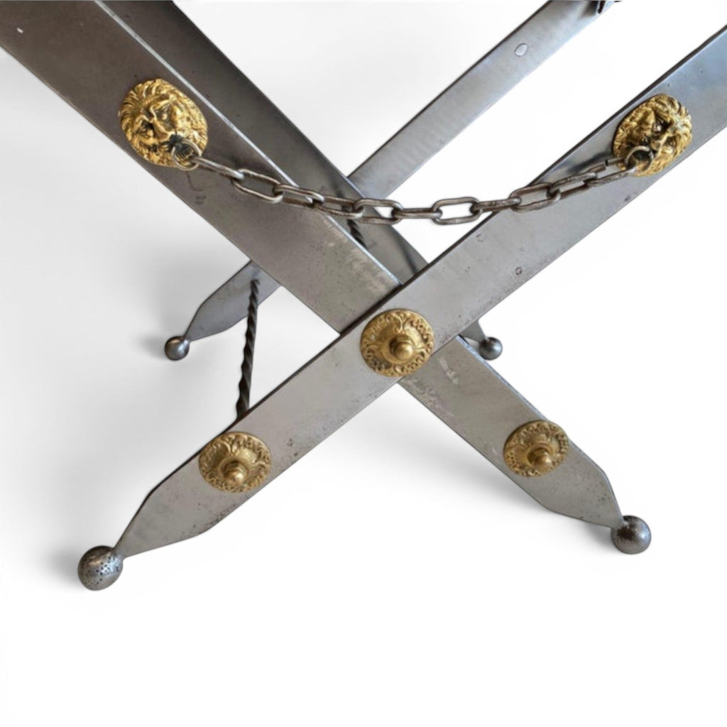 Tara Shaw sword stool with argenté metal frame, gold lion head accents, and decorative chain detail.