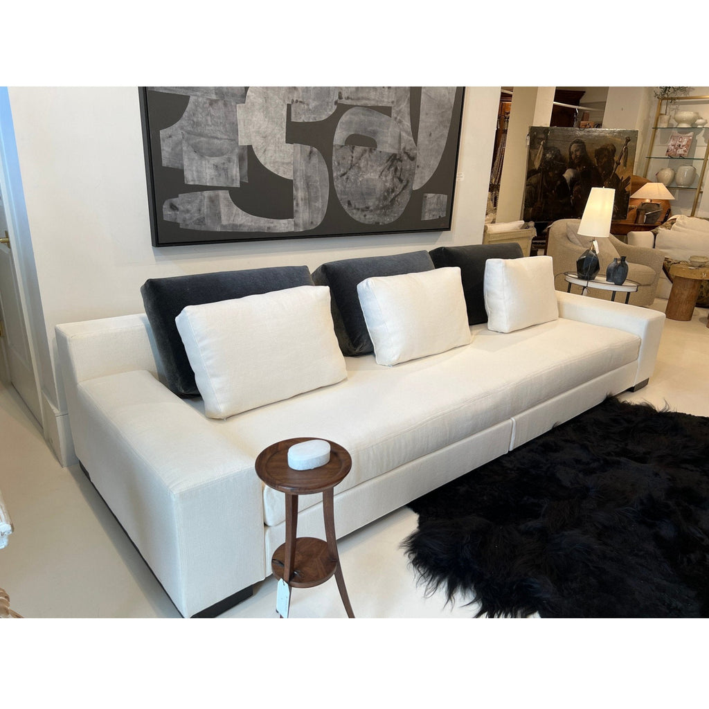 Tara Shaw Christian Liaigre Augustin sofa in oyster Belgium linen with charcoal mohair back pillows in a showroom