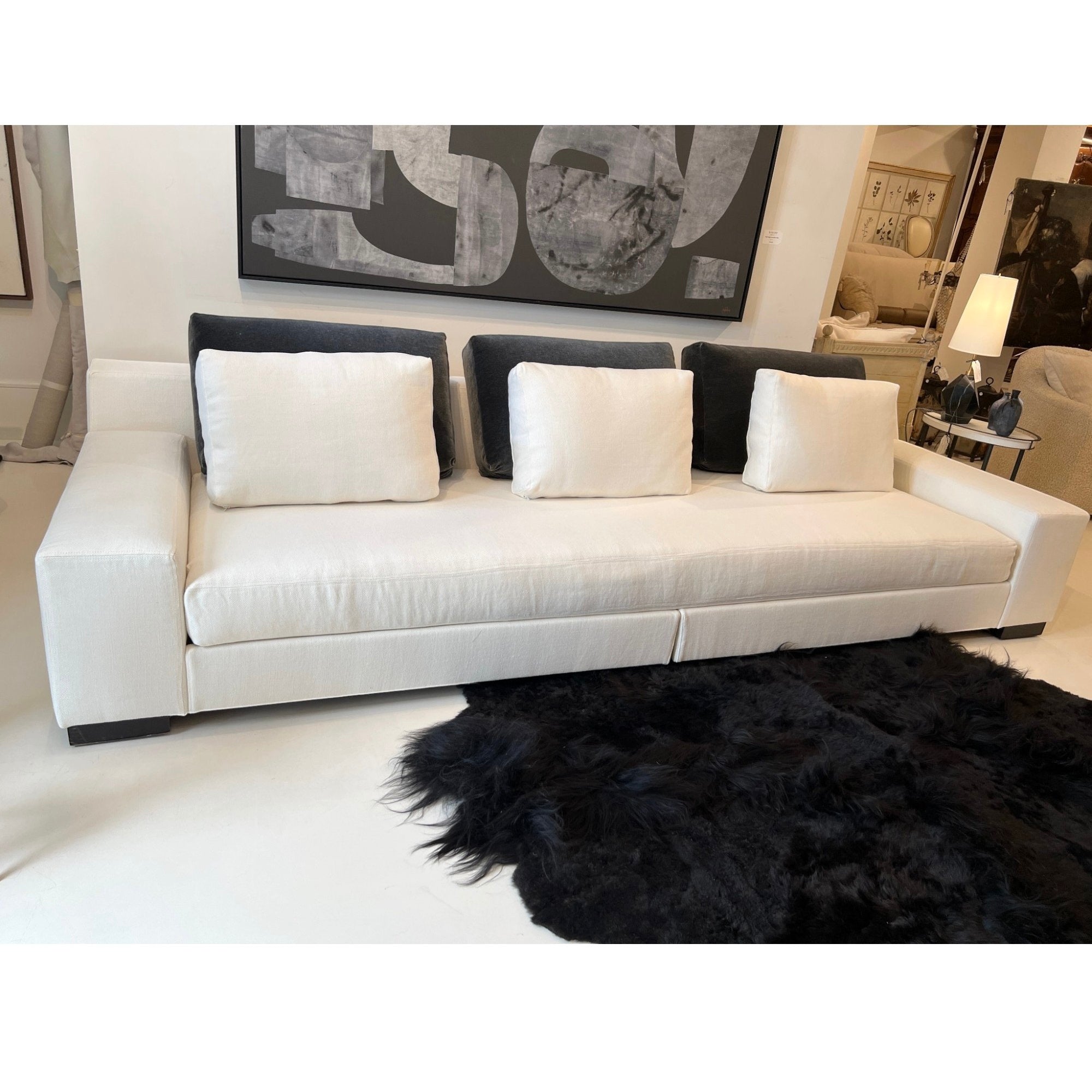 Tara Shaw Christian Liaigre Augustin sofa in oyster Belgium linen with contrasting charcoal mohair back pillows.