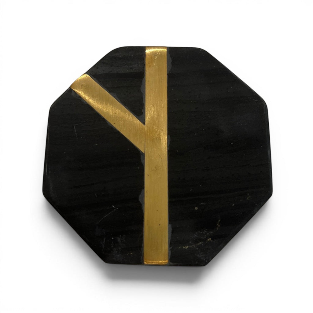 Tara Shaw black octagonal coaster with elegant gold inlay detail for modern home decor