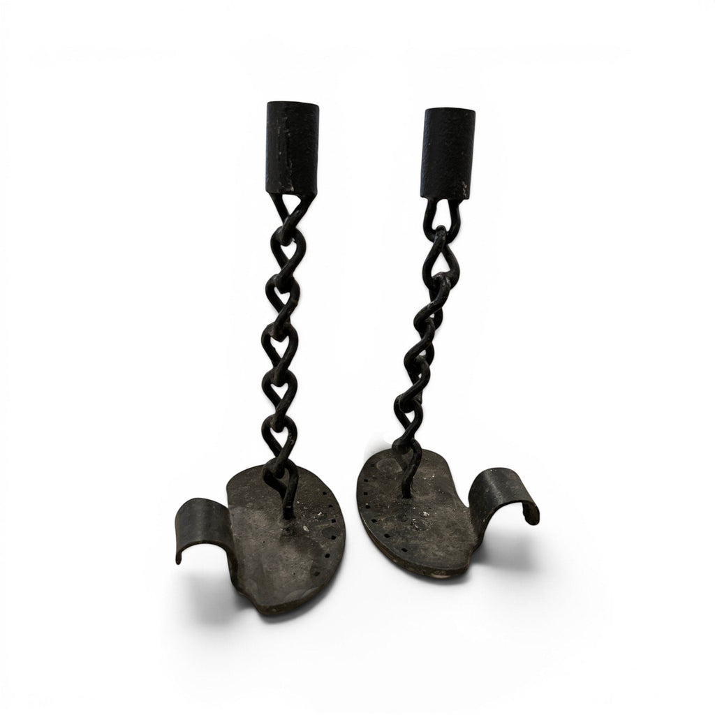 Tara Shaw pair of mid-century French black iron candlesticks with a sculptural chain-link design and aged finish.