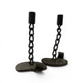Tara Shaw mid-century French pair of black iron candlesticks with a sculptural chain-link design and flat bases.