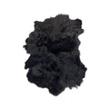 Tara Shaw black sheepskin rug with a textured high-low pile for a luxurious and modern interior accent.
