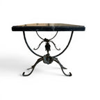 Tara Shaw bronze leaf base coffee table with a polished black marble top and intricate floral metal detailing.