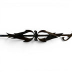 Tara Shaw bronze leaf table base with intricate sculptural metal detailing in a dark finish
