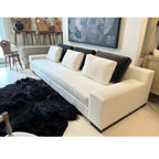Tara Shaw Christian Liaigre Augustin sofa in oyster Belgium linen with charcoal mohair back pillows in a showroom.