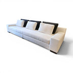 Tara Shaw Christian Liaigre Augustin sofa in oyster Belgium linen with contrasting charcoal mohair back pillows.