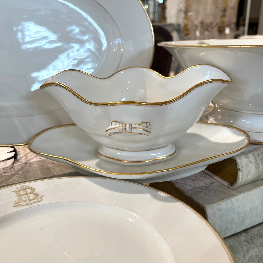 Tara Shaw French china gravy boat with gold trim and elegant monogrammed B on a matching saucer