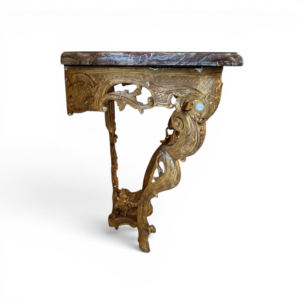 Tara Shaw 18th century French console table with ornate gilded wood frame, marble top, and sculptural hoof feet.