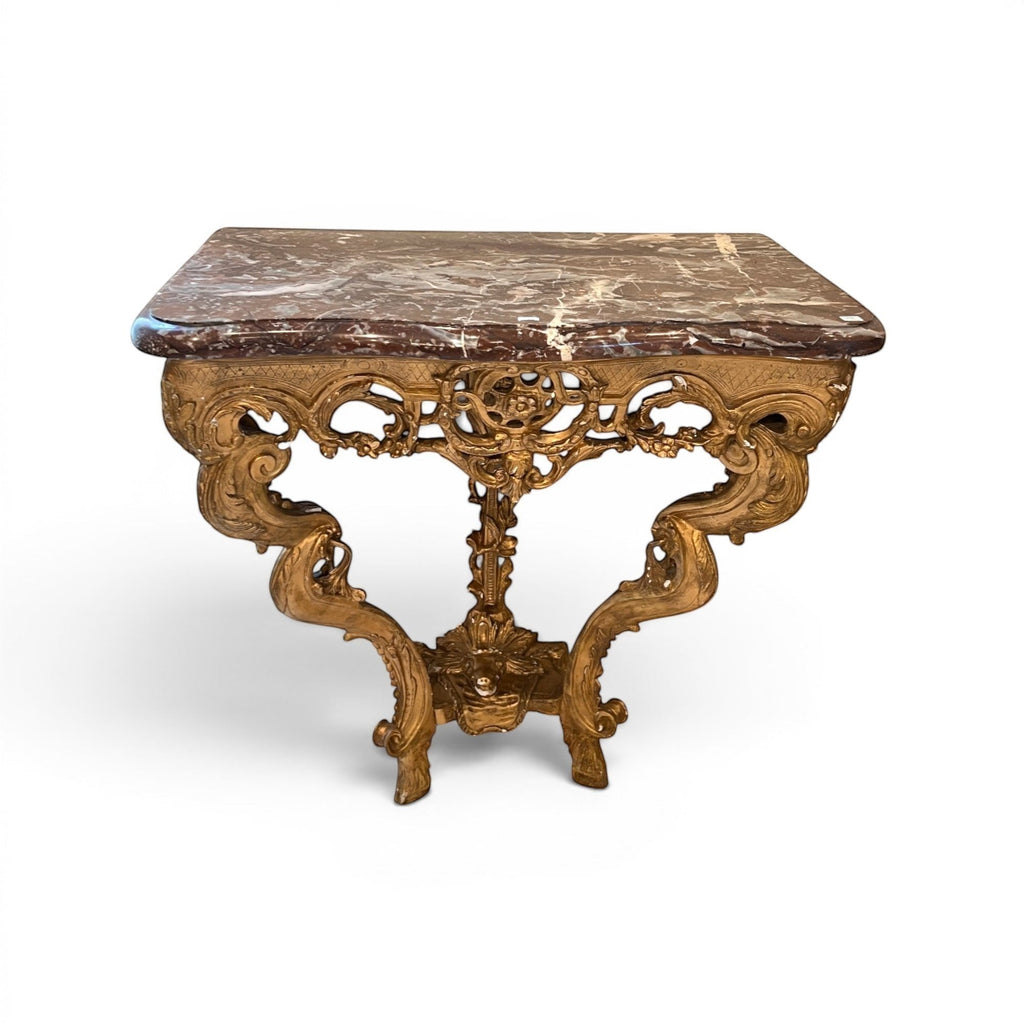 Tara Shaw 18th century French gilded console table with intricate carvings, marble top, and ornate hoof feet.