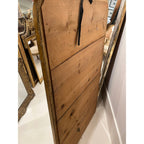Back view of a 19th century Tara Shaw French Louis Philippe mirror showing the wooden paneling and silver-leaf frame.