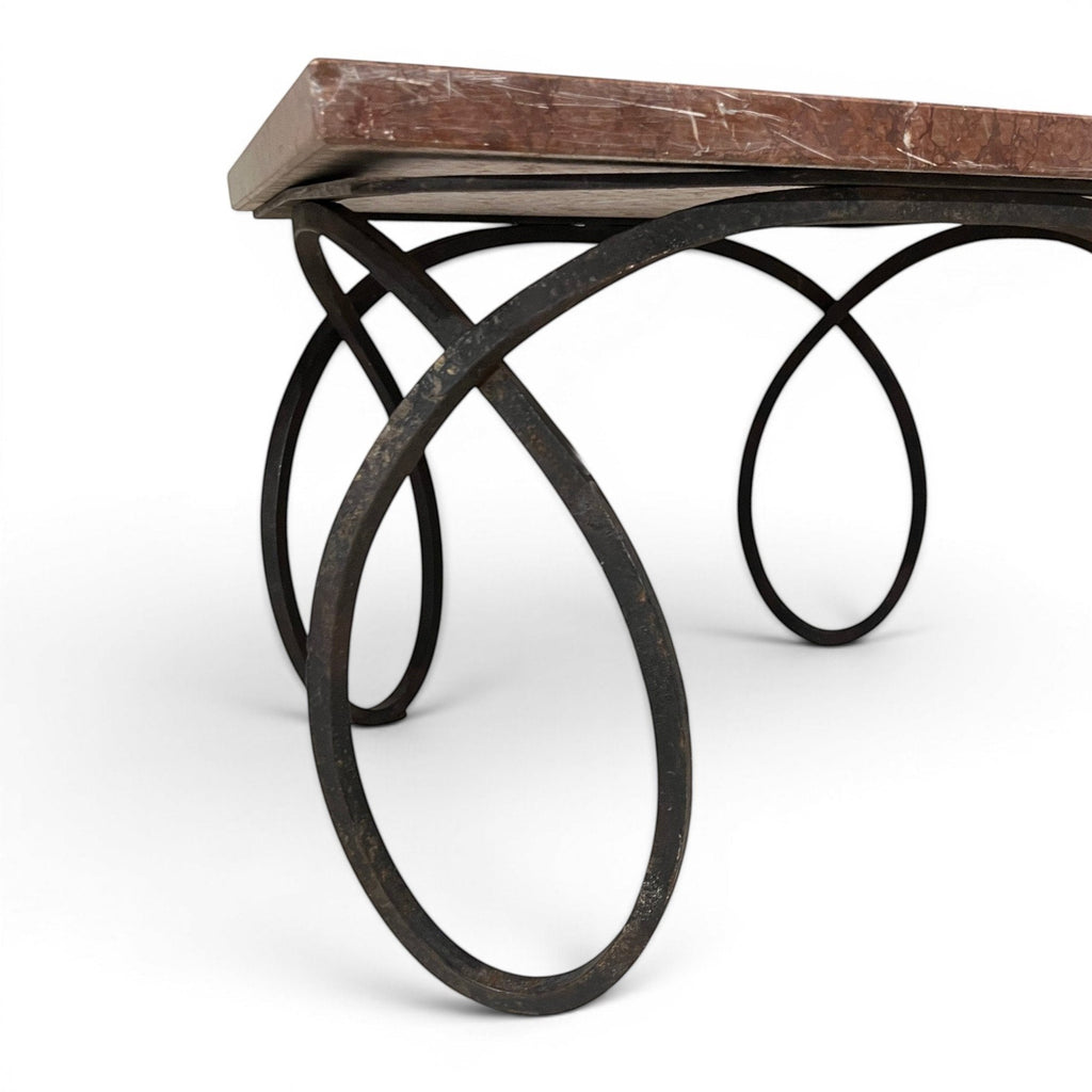 Tara Shaw early 20th-century French coffee table with a red veined marble top and sculptural dark metal curly base.