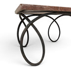 Tara Shaw early 20th-century French coffee table with a red veined marble top and sculptural dark metal curly base.