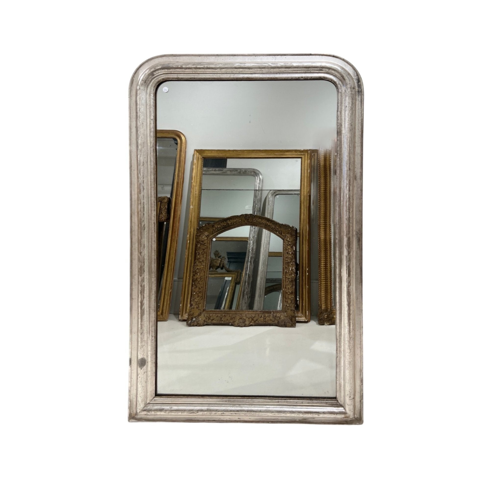 Tara Shaw 19th century French Louis Philippe mirror with a large silver-leaf frame and aged patina.
