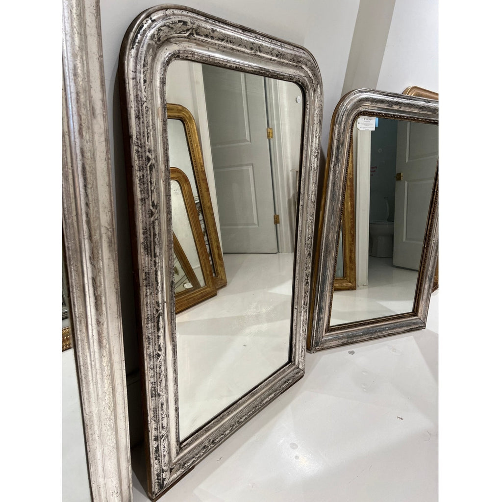 Tara Shaw 19th century French Louis Philippe mirror with a large silver-leaf frame and aged patina