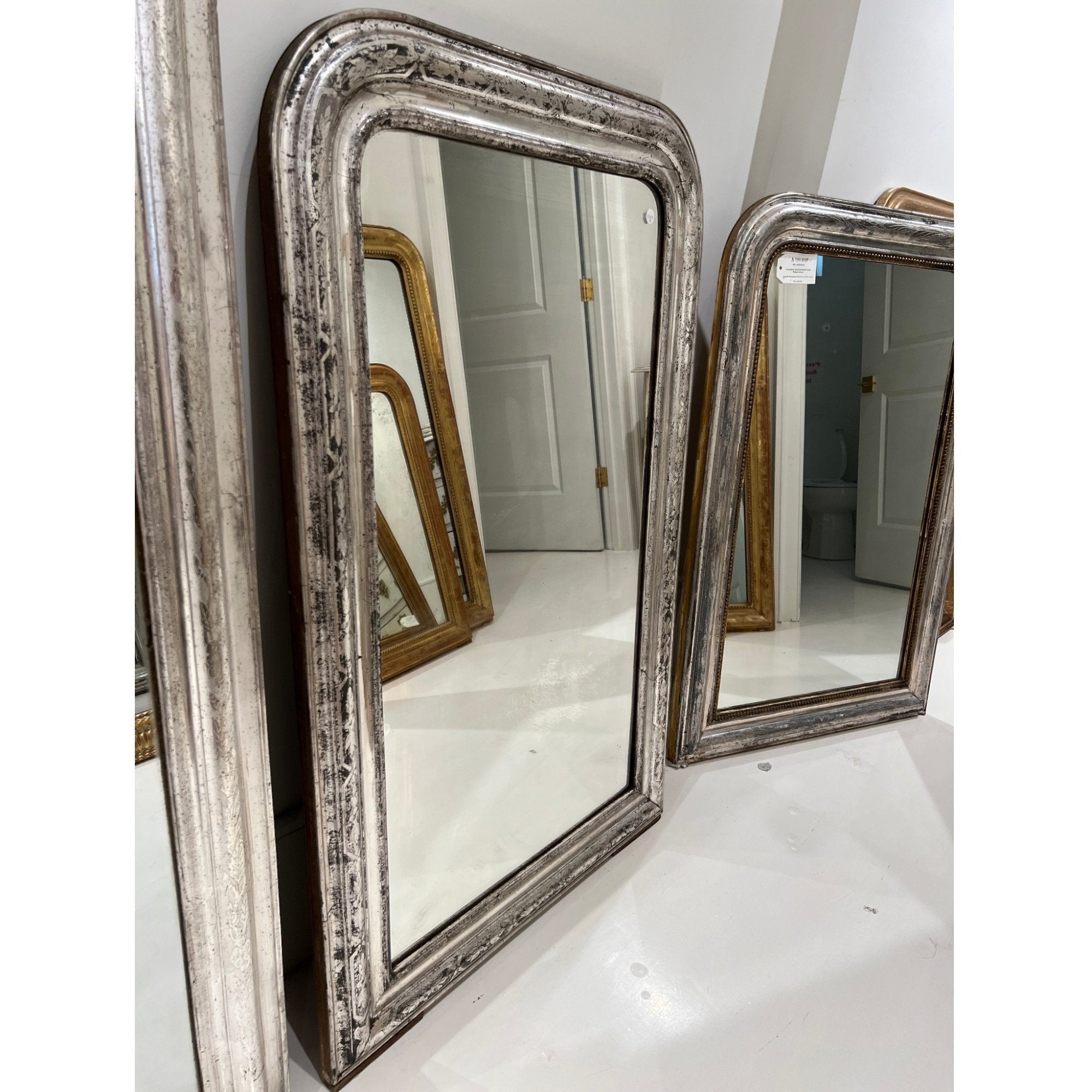 Tara Shaw 19th century French Louis Philippe mirror with a large silver-leaf frame and aged patina