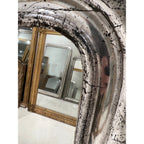 Tara Shaw 19th century French Louis Philippe mirror with a silver leaf frame and aged patina, close-up detail.