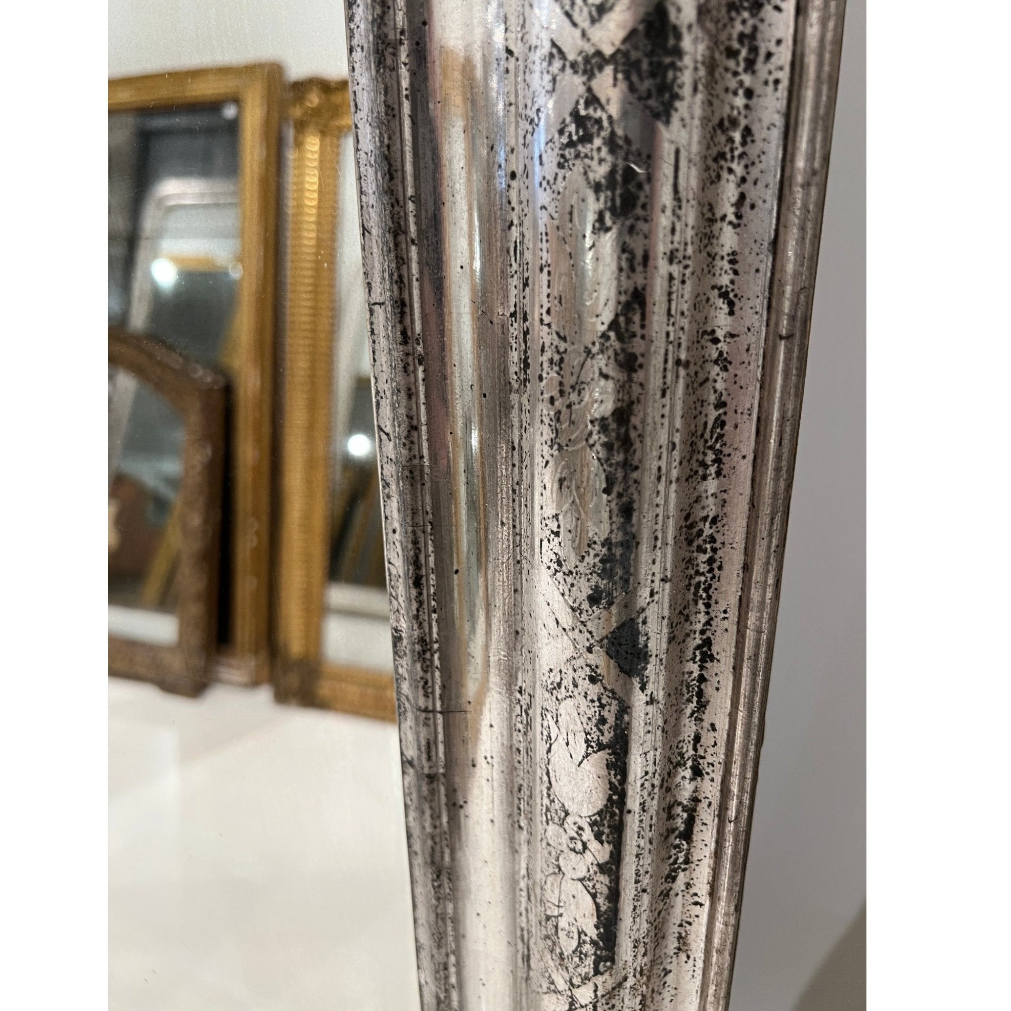 Tara Shaw 19th century French Louis Philippe mirror with a silver leaf frame and aged patina detail