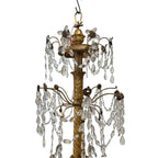 Tara Shaw 18th century Genoese chandelier with aged gold patina, scrolling arms, and cascading crystal teardrops.