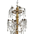 Tara Shaw 18th century Genoese chandelier with aged gold finish, scrolling arms, and cascading crystal teardrops.