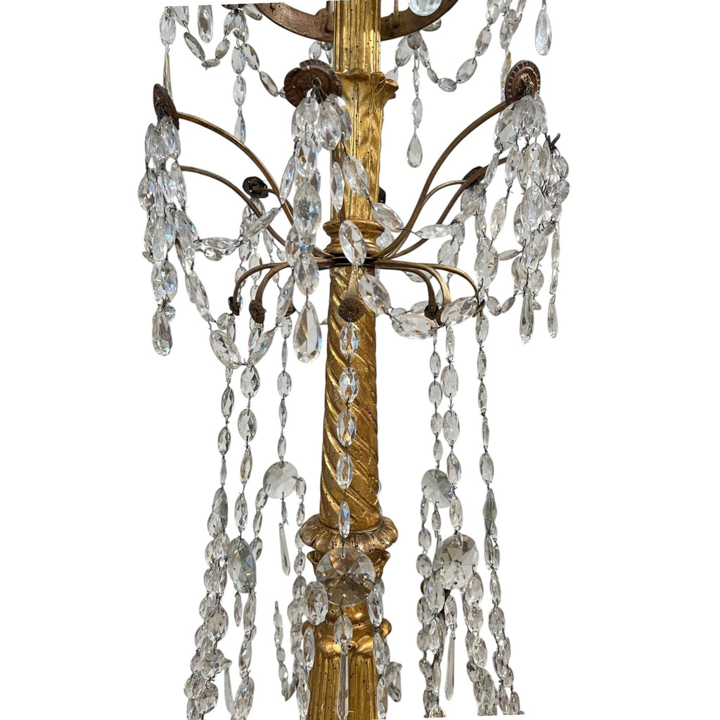 Tara Shaw 18th century Genoese chandelier with gold patina, scrolling arms, and cascading crystal teardrop prisms.