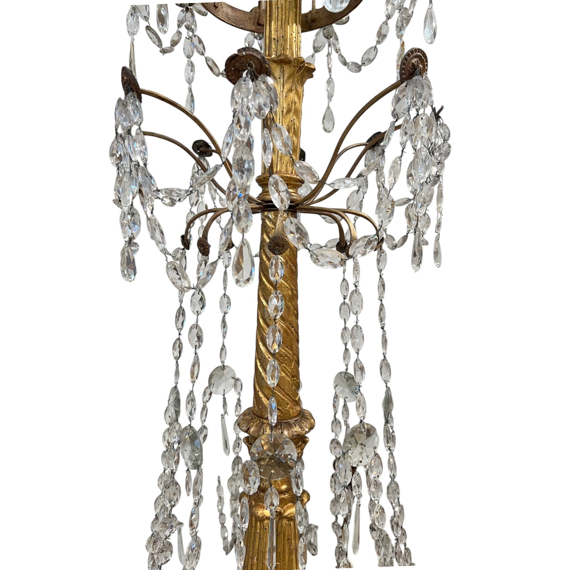 Tara Shaw 18th century Genoese chandelier with gold patina, scrolling arms, and cascading crystal teardrop prisms.
