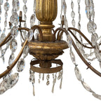 Tara Shaw 18th century Genovese chandelier with aged gold patina, scrolling arms, and cascading crystal pendants.