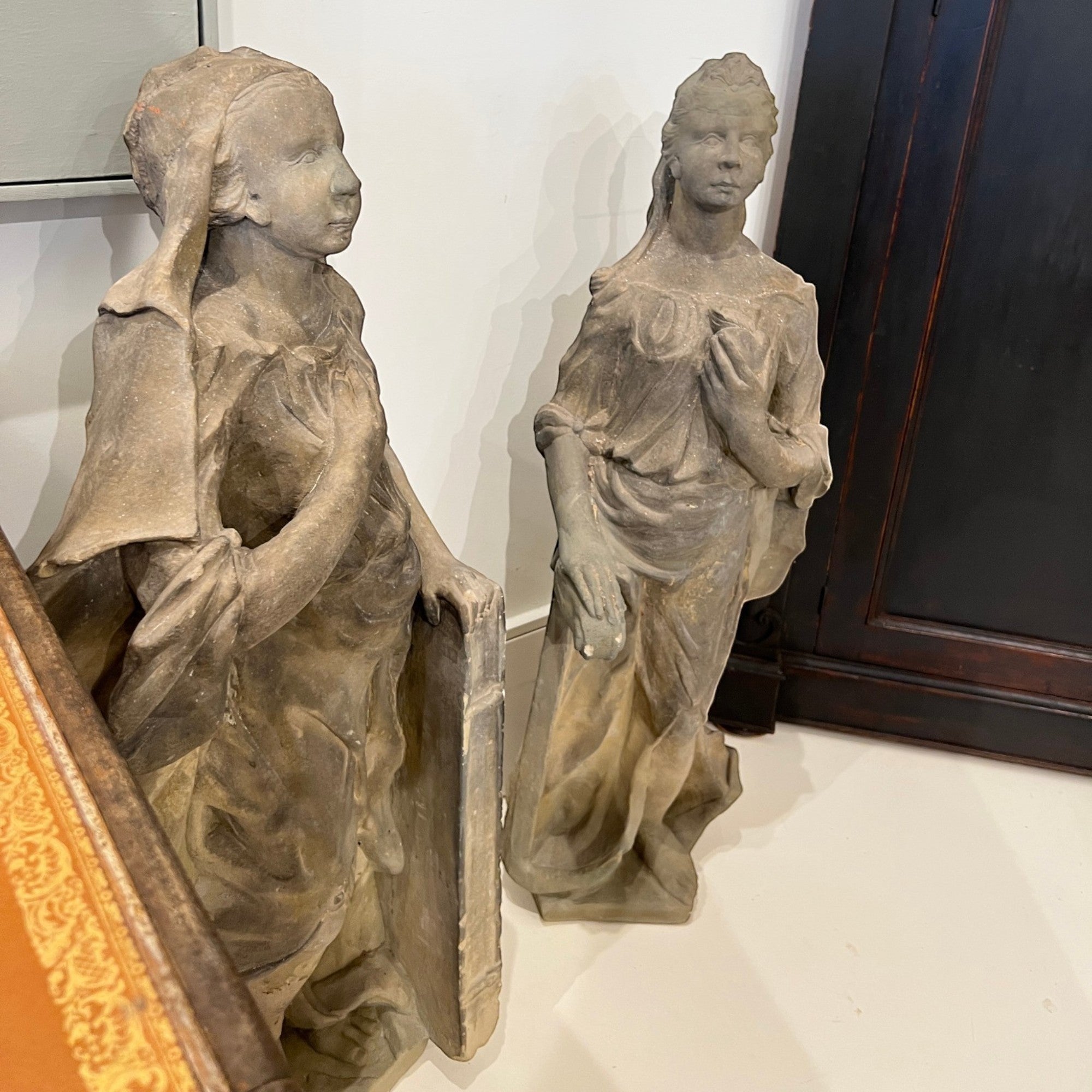 Tara Shaw pair of 18th century German stone statues featuring weathered female figures with classical sculptural detail