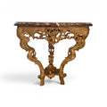 Tara Shaw 18th century French gilded console table with intricate carvings, marble top, and ornate hoof feet.
