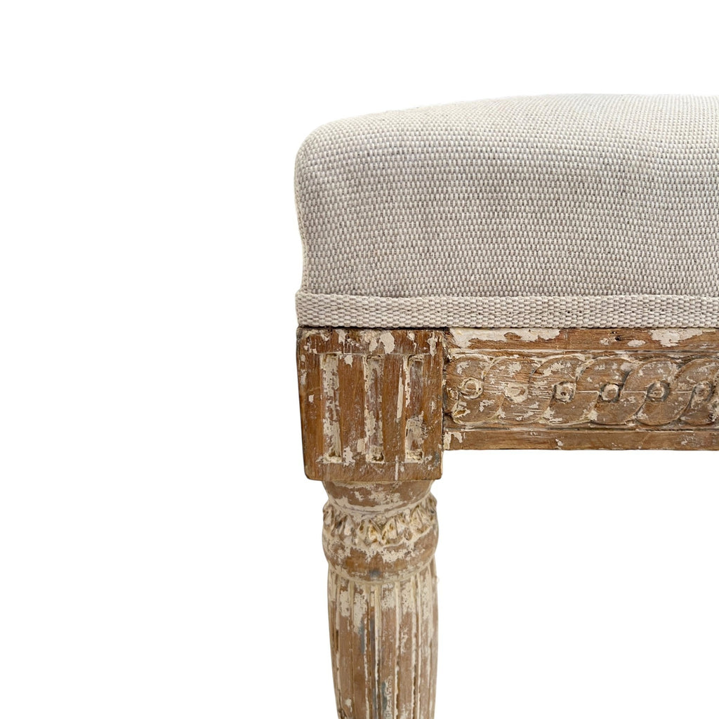 Tara Shaw 18th century Swedish Gustavian chair detail with distressed wood carving and beige linen upholstered seat