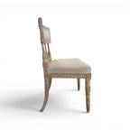 Tara Shaw 18th century Swedish Gustavian chair with distressed wood finish and beige linen upholstered seat, side view.