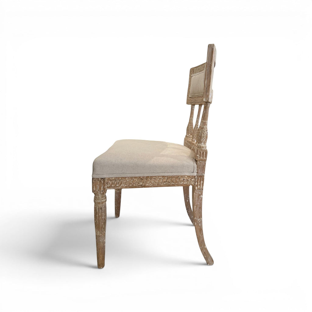 Tara Shaw 18th century Swedish Gustavian chair with distressed wood finish and beige linen upholstery, side view.
