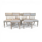 Tara Shaw set of six 18th-century Swedish Gustavian chairs with distressed wood frames and light linen upholstery.