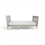 Tara Shaw 18th century Gustavian daybed with carved wood frame, aged patina, and light linen upholstered cushion.