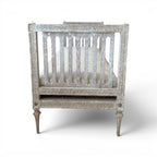 Tara Shaw 18th century Gustavian daybed with carved wood frame, aged patina, and neutral upholstered seat.